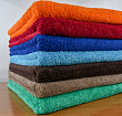 Махровые цветные гладкокрашеные полотенца